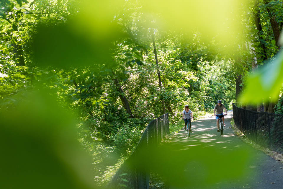 two people biking thru trail