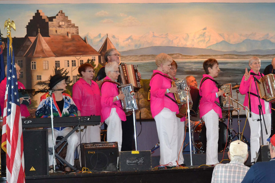 A troop of old ladies playing button accordion at Festival