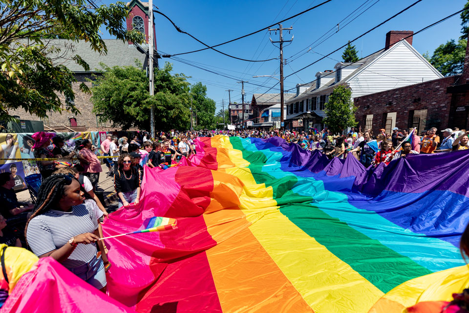 Pride flag display at parade