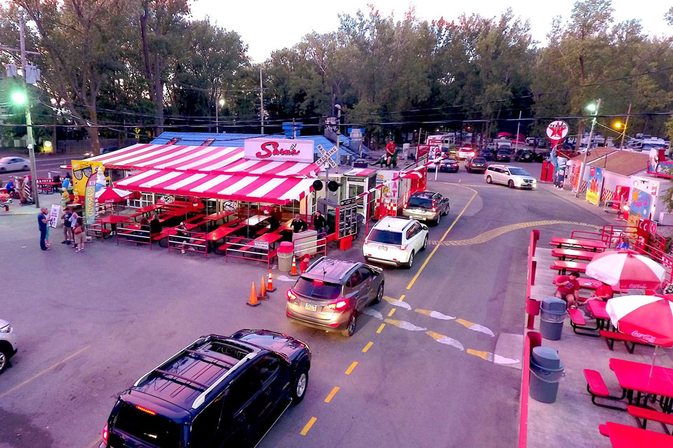 aerial view of cars line-up at sara's restaurant