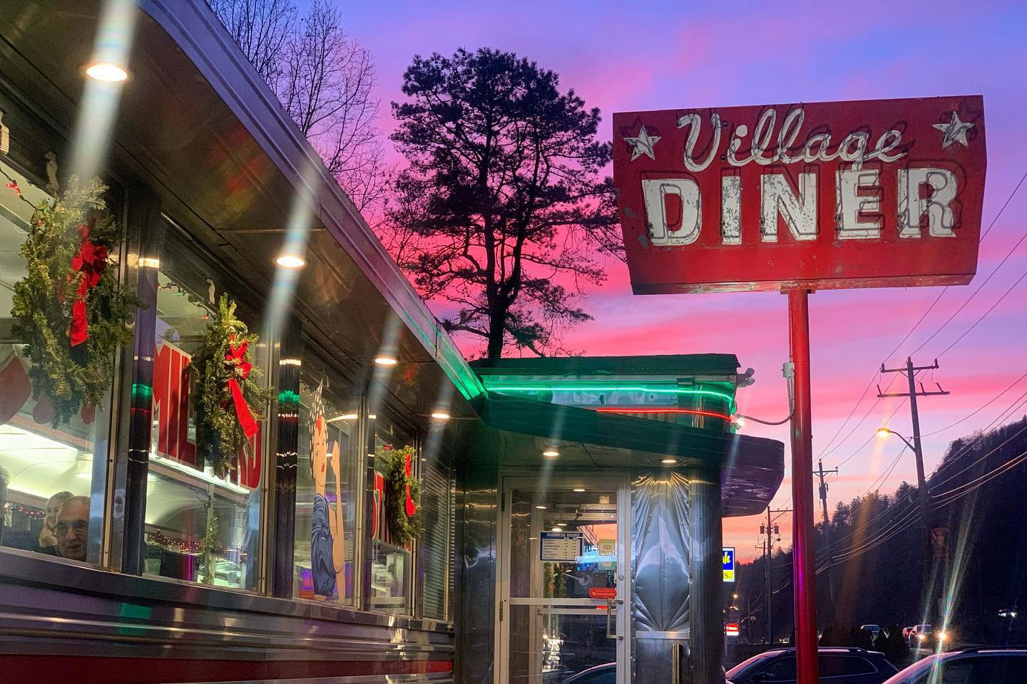 photo of vintage village diner signage and building at a beautiful evening